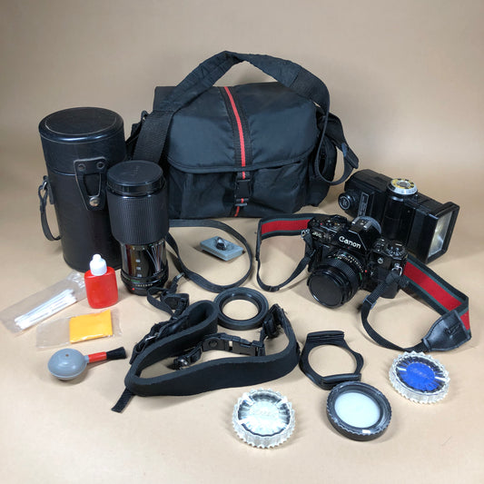 Canon A-1 Black 35mm Focal-Plane Shutter SLR Film Camera with 2 Lens