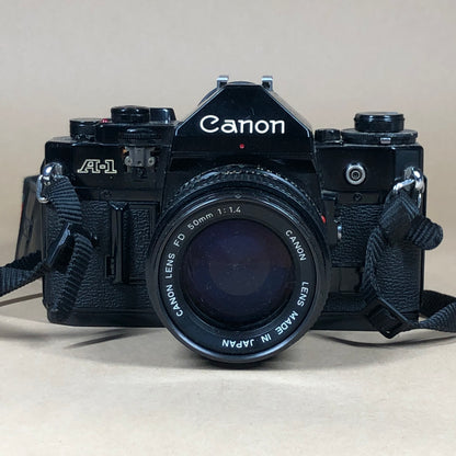 Canon A-1 Black 35mm Focal-Plane Shutter SLR Film Camera with 2 Lens